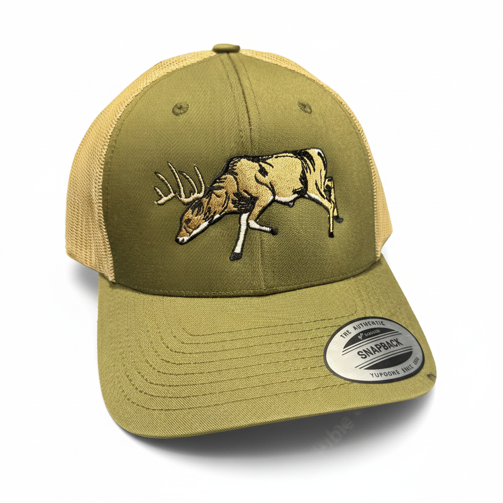 Green and beige cap with deer design on a red and black background