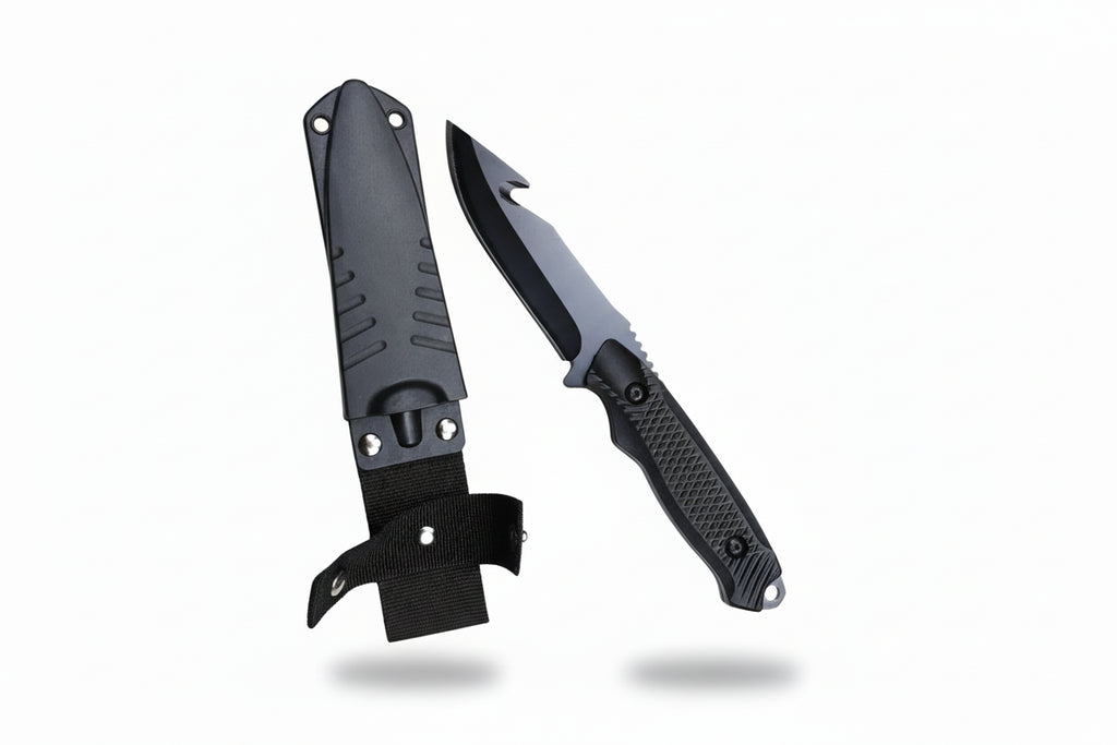 Folding knife with black blade and handle on a wooden surface